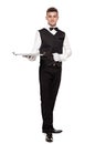 Portrait of young happy smiling waiter with on tray isolated on Royalty Free Stock Photo