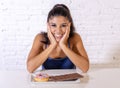 Portrait of young happy woman eating delighted chocolate bar and donuts Royalty Free Stock Photo