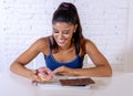 Portrait of young happy woman eating delighted chocolate bar and donuts Royalty Free Stock Photo