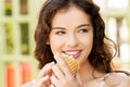 Portrait of young happy woman eating ice-cream Royalty Free Stock Photo