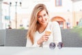 Portrait of young happy woman eating ice-cream, outdoor Royalty Free Stock Photo