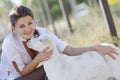 Portrait of young happy woman with goat Royalty Free Stock Photo