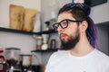 Portrait of young hipster man with dreadlocks in cafe Royalty Free Stock Photo