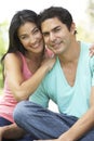 Portrait Of Young Hispanic Couple In Park Royalty Free Stock Photo