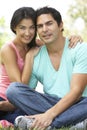 Portrait Of Young Hispanic Couple In Park Royalty Free Stock Photo