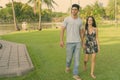 Young Hispanic couple relaxing in the park together Royalty Free Stock Photo