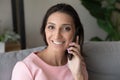 Portrait of young indian arabic woman holding mobile phone conversation.