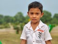 Portrait of a young Indian boy looking at the camera with a serious face Royalty Free Stock Photo