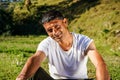 Portrait of a young indian farmer resting in the fields captured early in the morning