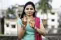 Portrait of a young Indian woman in casual style with mehendi or henna design on the both hands Royalty Free Stock Photo