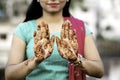 Portrait of a young Indian woman in casual style with mehendi or henna design on the both hands Royalty Free Stock Photo