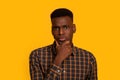 Portrait Of Young Interested Black Guy Touching Chin, Thinking About Offer Royalty Free Stock Photo