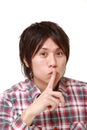 Young Japanese man whith silence gestures