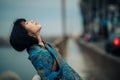 Portrait of young Japanese relaxed woman on the bridge Royalty Free Stock Photo