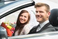 Young Just Married Couple In Car Royalty Free Stock Photo