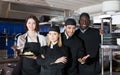 Portrait of young kitcheners and woman waiter Royalty Free Stock Photo