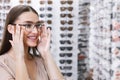 Portrait of young lady wearing spectacles in store Royalty Free Stock Photo