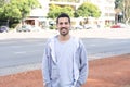 Portrait of young latin man. Urban scene.