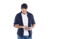 Portrait of a young latin man using tablet. Isolated white background Royalty Free Stock Photo