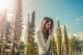 Woman smelling a flower in a flower field