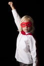 Portrait of young little girl wearing super hero costume in studio Royalty Free Stock Photo