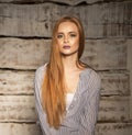 Portrait of a young long-haired ginger girl