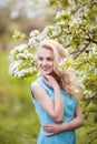 Portrait of young lovely woman in spring flowers Royalty Free Stock Photo