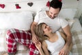 Portrait of young loving couple in bedroom Royalty Free Stock Photo