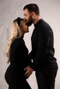 Man kissing his pregnant wife Royalty Free Stock Photo