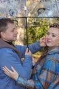 Portrait of a young loving couple smiling while standing under an umbrella Royalty Free Stock Photo