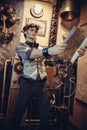 Portrait of a young mad scientist traveler in a steampunk style Royalty Free Stock Photo