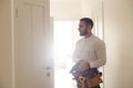 Portrait Young Male Carpenter Repairing Door Lock Royalty Free Stock Photo