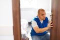 Portrait Young Male Carpenter Repairing Door Lock Royalty Free Stock Photo