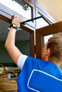 Portrait Young Male Carpenter Repairing Door Window Royalty Free Stock Photo