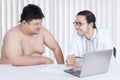 Doctor showing a medical result to his patient