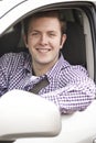 Portrait Of Young Male Driver Looking Out Of Car Window Royalty Free Stock Photo