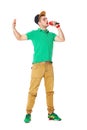 Portrait of young male hip hopper singing in studio isolated on Royalty Free Stock Photo