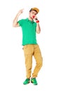 Portrait of young male hip hopper singing in studio isolated on Royalty Free Stock Photo