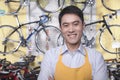 Portrait of young male mechanic in bicycle store, Beijing