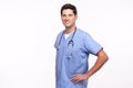 Portrait of a young male nurse posing with hands on hips Royalty Free Stock Photo
