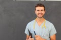 Portrait of young male nurse in scrubs smiling Royalty Free Stock Photo