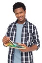 Portrait of a young male painter with palette Royalty Free Stock Photo
