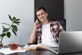 Portrait of a young male programmer student freelancer working a Royalty Free Stock Photo