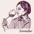 Portrait of a young male sommelier wine waiter, wine tasting