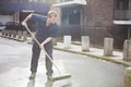 Portrait of young male street sweeper