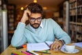 Portrait of young male student studying in a library. Education study teenager concept Royalty Free Stock Photo