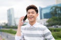 Portrait of a young male traveler talking on mobile phone Royalty Free Stock Photo