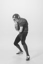 Portrait of young man, american football player posing. Black and white photography. Funny pose