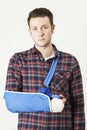 Portrait Of Young Man With Arm In Sling Royalty Free Stock Photo