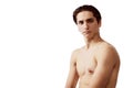 Portrait of young man attentively looking at camera, posing shirtless isolated over white background. Concept of male Royalty Free Stock Photo